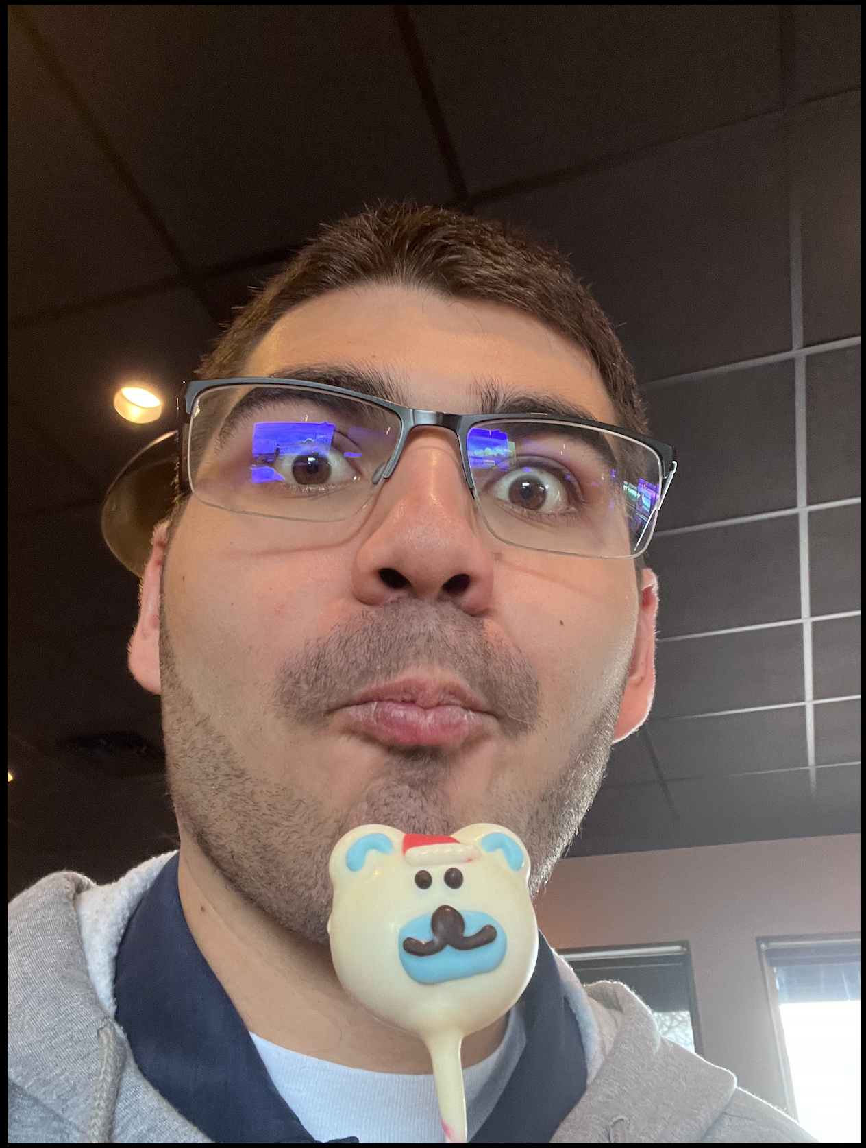 Ian holding a cake pop